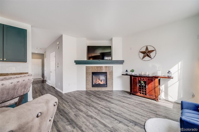 22765 E Ottawa Pl, Aurora, CO 80016 - living area featuring wood finished floors and a tiled fireplace
