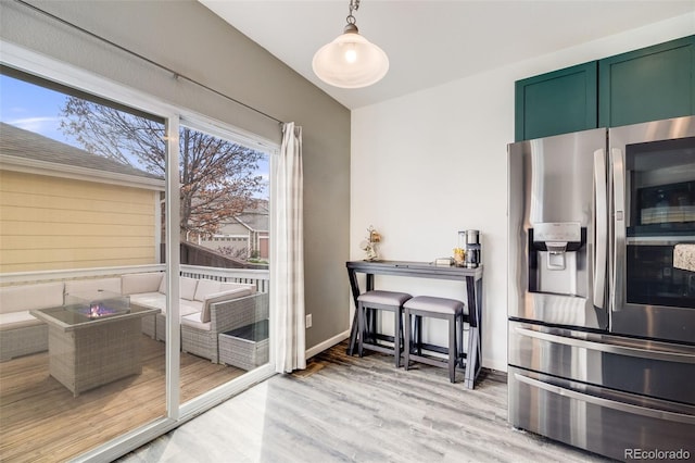 22765 E Ottawa Pl, Aurora, CO 80016 - kitchen featuring stainless steel refrigerator with ice dispenser, green cabinets, and wood finished floors
