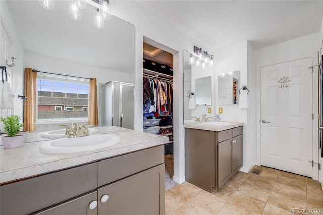 22765 E Ottawa Pl, Aurora, CO 80016 - full bath with two vanities and a walk in closet