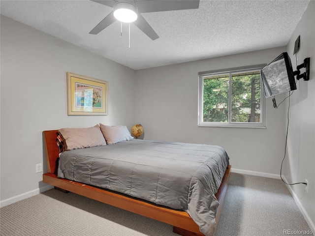 4720 W Stanford Ave, Denver, CO 80236 - carpeted bedroom featuring a textured ceiling and a ceiling fan