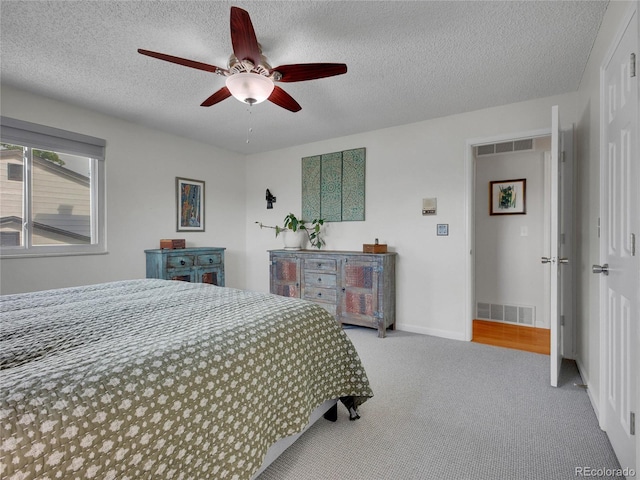 4720 W Stanford Ave, Denver, CO 80236 - carpeted bedroom with a textured ceiling and ceiling fan