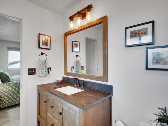 4720 W Stanford Ave, Denver, CO 80236 - ensuite bathroom featuring vanity and toilet