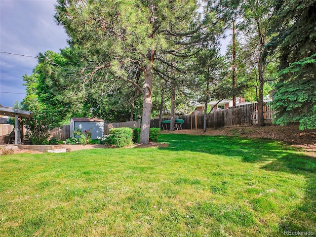 4720 W Stanford Ave, Denver, CO 80236 - fenced backyard featuring a storage shed