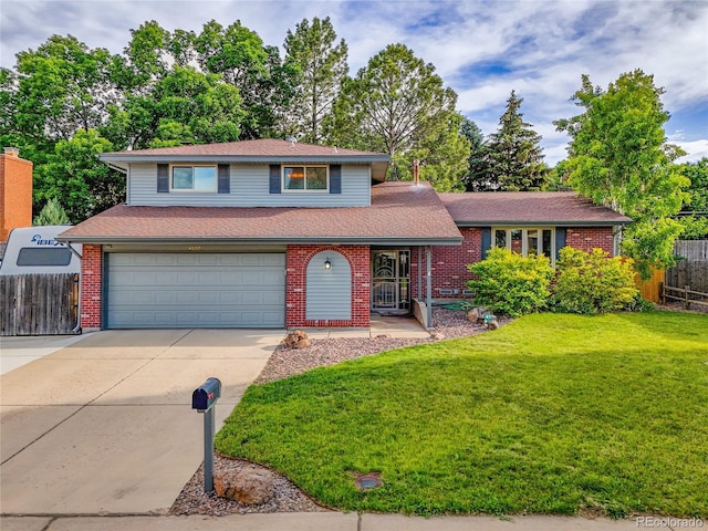 4720 W Stanford Ave, Denver, CO 80236 - tri-level home featuring driveway, a garage, brick siding, a shingled roof, and a porch