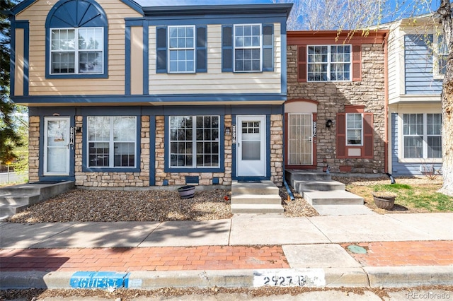 view of property featuring stone siding