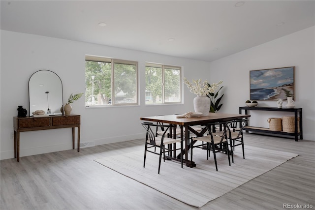 8249 Zephyr St, Arvada, CO 80005 - dining space with light wood-style floors and recessed lighting