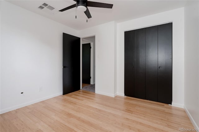 8249 Zephyr St, Arvada, CO 80005 - unfurnished bedroom featuring light wood finished floors, a closet, and a ceiling fan