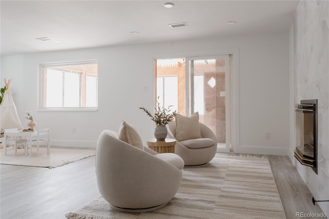 8249 Zephyr St, Arvada, CO 80005 - living area featuring light wood-type flooring and baseboards