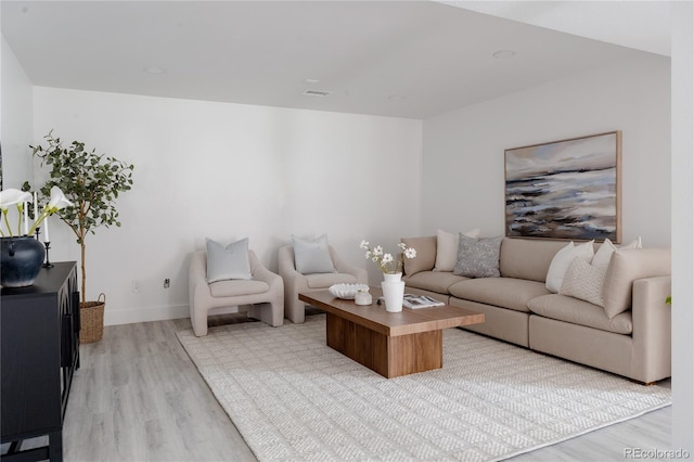 8249 Zephyr St, Arvada, CO 80005 - living room with light wood-style floors and baseboards