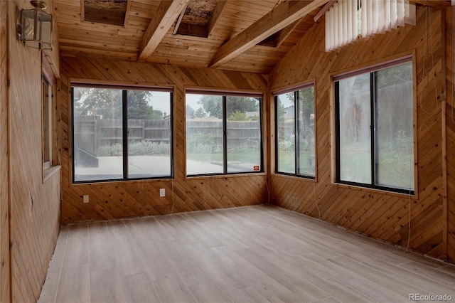 8249 Zephyr St, Arvada, CO 80005 - unfurnished sunroom with wood walls, healthy amount of natural light, wood finished floors, and wood ceiling