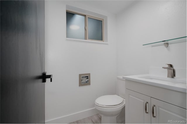 8249 Zephyr St, Arvada, CO 80005 - bathroom featuring vanity and wood finished floors