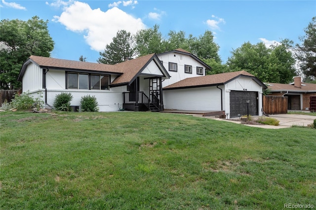 8249 Zephyr St, Arvada, CO 80005 - split level home featuring an attached garage and concrete driveway