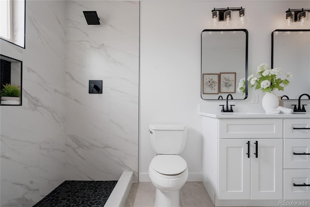 8249 Zephyr St, Arvada, CO 80005 - full bath with vanity, a marble finish shower, and tile patterned flooring