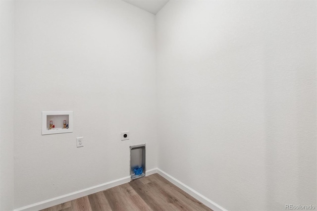 washroom with light wood finished floors, baseboards, laundry area, hookup for a washing machine, and hookup for an electric dryer