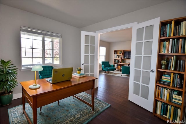 office space featuring french doors and dark hardwood / wood-style floors