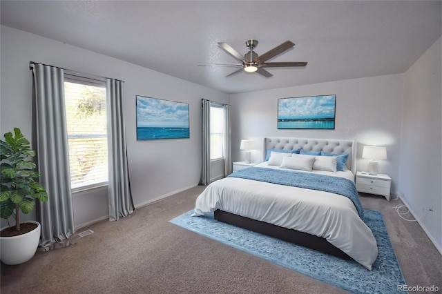 carpeted bedroom with ceiling fan