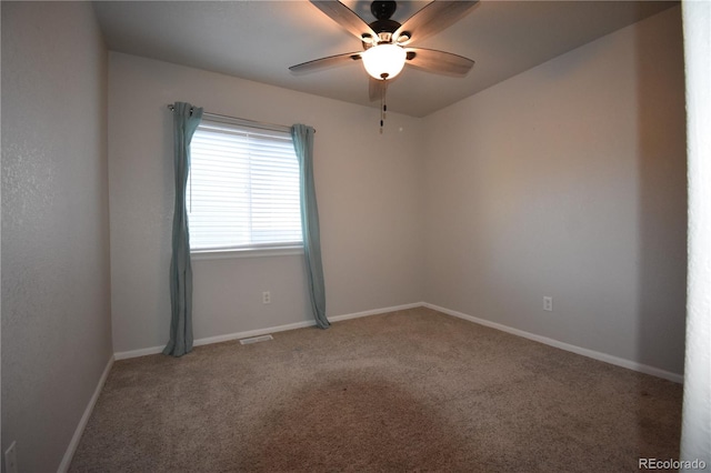 carpeted empty room with ceiling fan