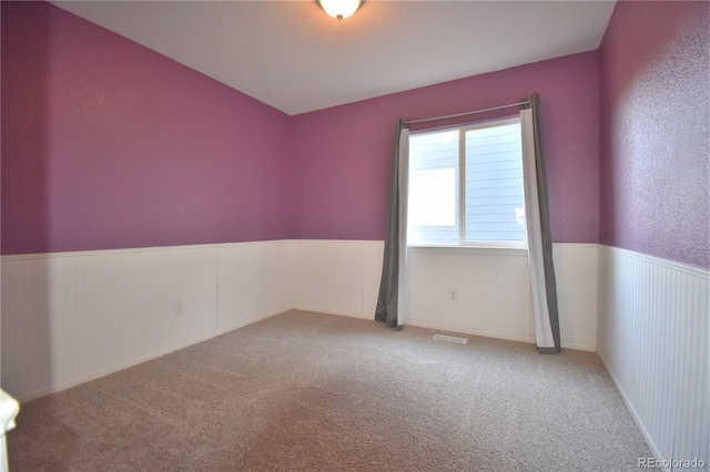 unfurnished room with carpet flooring