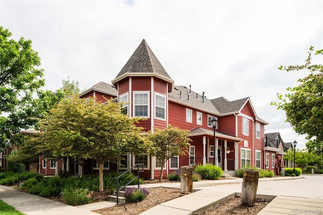 7777 E 23rd Ave Unit 1202, Denver, CO 80238 - victorian-style house featuring a shingled roof