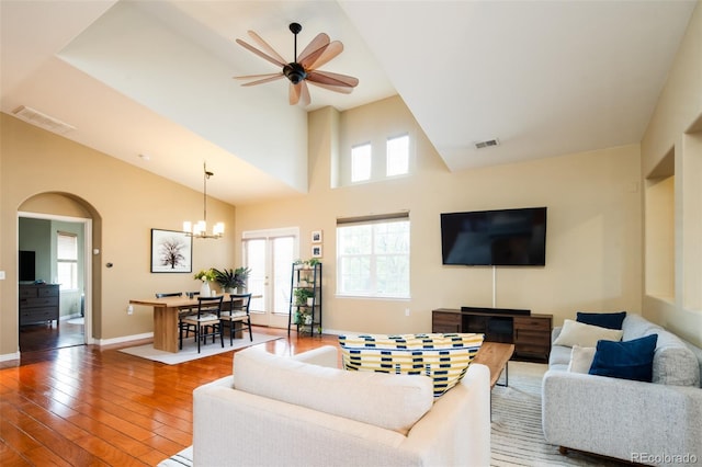 7777 E 23rd Ave Unit 1202, Denver, CO 80238 - living area featuring hardwood / wood-style floors, healthy amount of natural light, arched walkways, and high vaulted ceiling