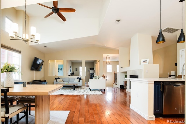 7777 E 23rd Ave Unit 1202, Denver, CO 80238 - kitchen with stainless steel dishwasher, plenty of natural light, light countertops, a ceiling fan, and vaulted ceiling
