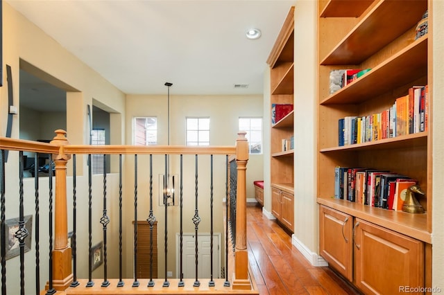 7777 E 23rd Ave Unit 1202, Denver, CO 80238 - corridor featuring wood-type flooring, an upstairs landing, and recessed lighting