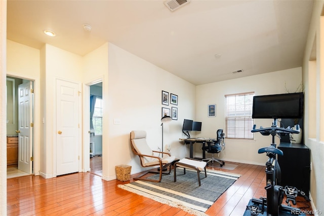 7777 E 23rd Ave Unit 1202, Denver, CO 80238 - living area featuring light wood-type flooring and a desk