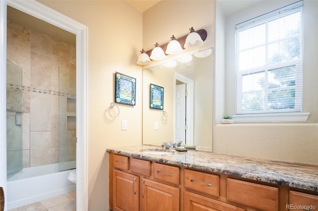 7777 E 23rd Ave Unit 1202, Denver, CO 80238 - full bathroom featuring vanity, healthy amount of natural light, shower / bathtub combination, and tile patterned floors