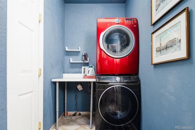 7777 E 23rd Ave Unit 1202, Denver, CO 80238 - laundry room featuring stacked washing machine and dryer and baseboards