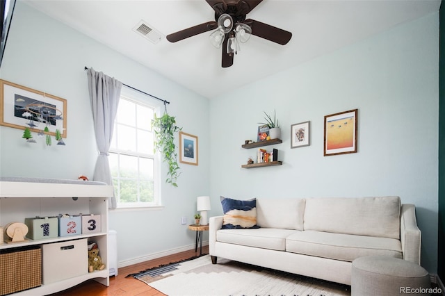 7777 E 23rd Ave Unit 1202, Denver, CO 80238 - living area with wood finished floors and ceiling fan