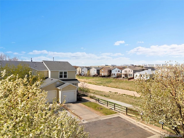 birds eye view of property with a residential view