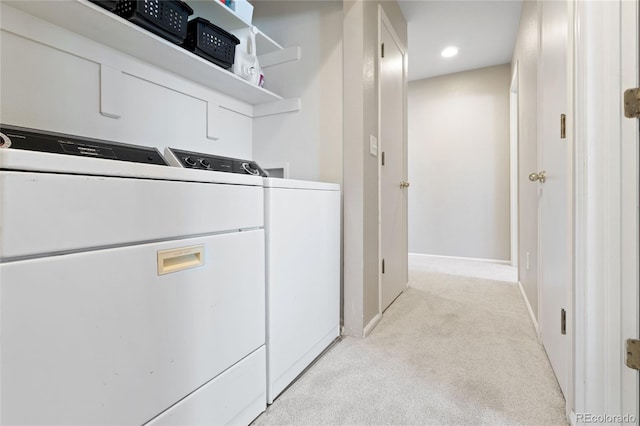 laundry room featuring washer and clothes dryer, light colored carpet, baseboards, laundry area, and recessed lighting