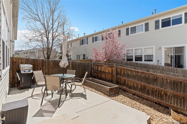 view of patio / terrace featuring a fenced backyard, outdoor dining area, and area for grilling