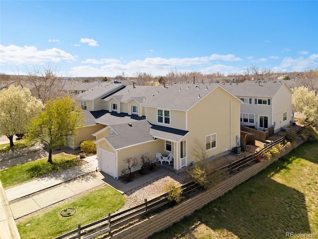 birds eye view of property with a residential view