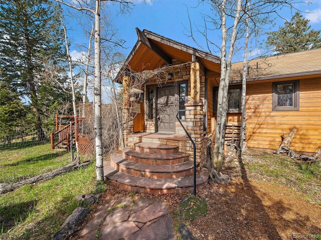 7754 Swaps Trl, Evergreen, CO 80439 - doorway to property with fence
