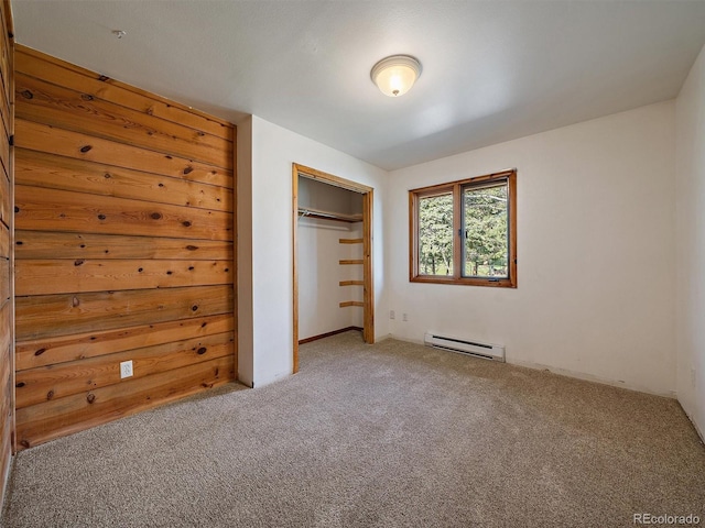 7754 Swaps Trl, Evergreen, CO 80439 - unfurnished bedroom featuring a baseboard radiator, carpet flooring, and a closet