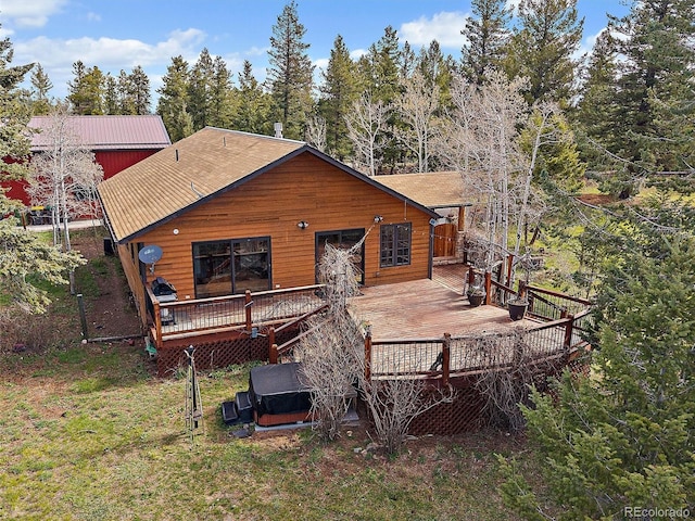 7754 Swaps Trl, Evergreen, CO 80439 - back of house featuring a deck and a jacuzzi
