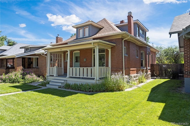 bungalow-style home with a porch and a front lawn