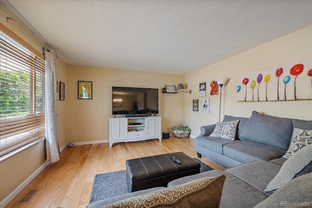 4855 E Atlantic Pl, Denver, CO 80222 - living room featuring light wood-type flooring and baseboards