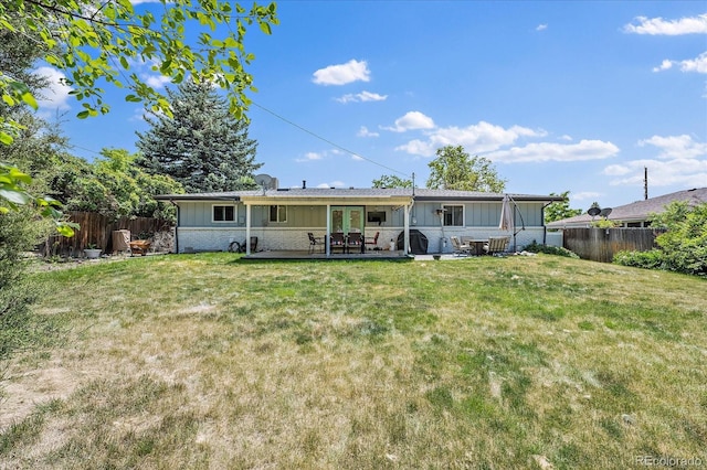 4855 E Atlantic Pl, Denver, CO 80222 - rear view of property with board and batten siding, french doors, a patio, and brick siding