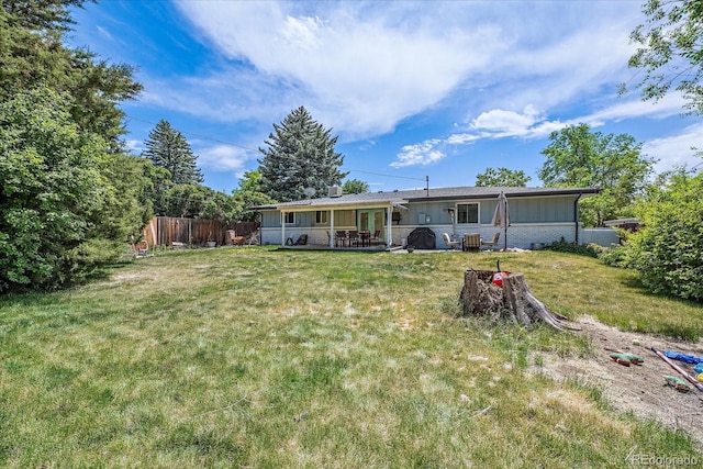 4855 E Atlantic Pl, Denver, CO 80222 - back of house featuring a patio area and board and batten siding