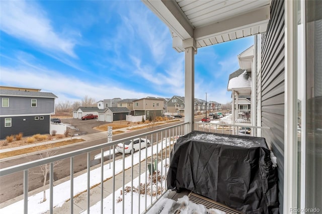 snow covered back of property featuring area for grilling