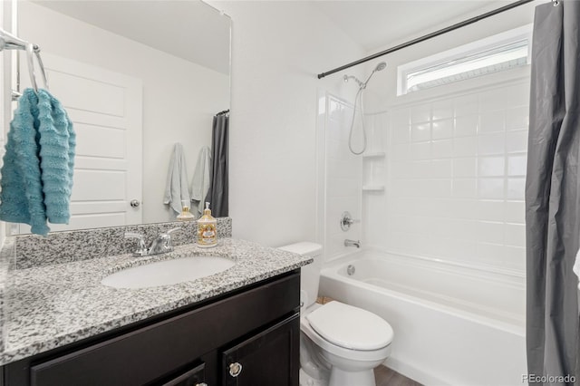 full bathroom featuring shower / bath combination with curtain, vanity, and toilet