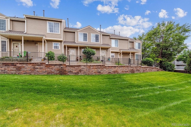 1818 S Quebec Way Unit 4, Denver, CO 80231 - rear view of house featuring a yard