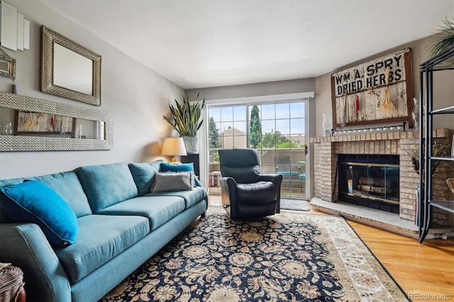 1818 S Quebec Way Unit 4, Denver, CO 80231 - living area featuring wood finished floors and a fireplace