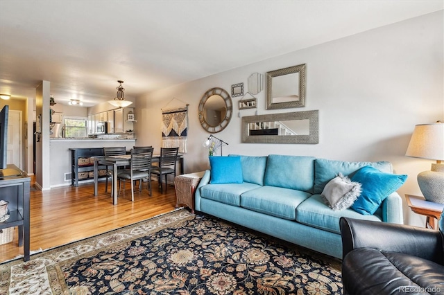 1818 S Quebec Way Unit 4, Denver, CO 80231 - living area featuring wood finished floors
