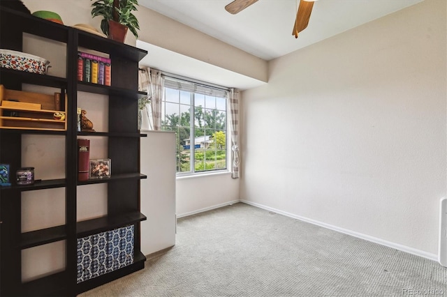 1818 S Quebec Way Unit 4, Denver, CO 80231 - empty room with carpet flooring, baseboards, and ceiling fan