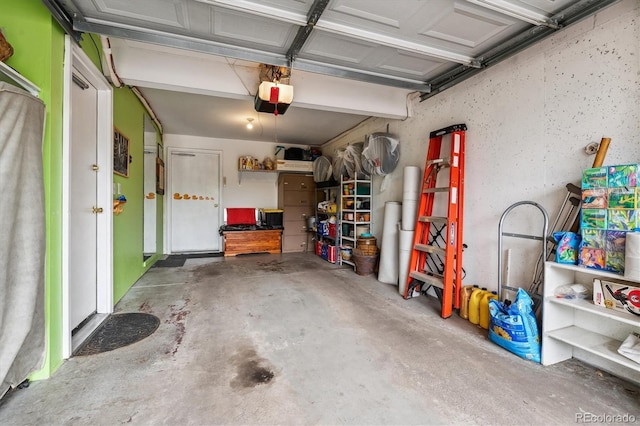 1818 S Quebec Way Unit 4, Denver, CO 80231 - garage featuring a garage door opener