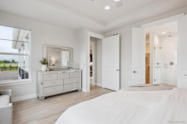 22183 E Rocky Top Pl, Aurora, CO 80016 - bedroom with light wood-style flooring, recessed lighting, and ensuite bathroom