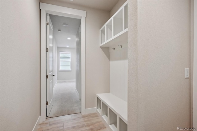 22183 E Rocky Top Pl, Aurora, CO 80016 - mudroom featuring light wood-style floors and baseboards